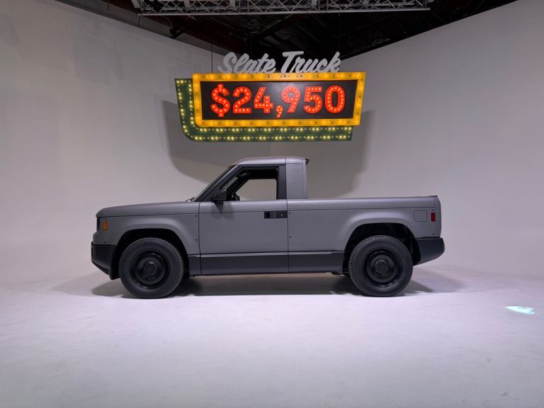 The Slate electric pickup truck with a neon sign above it spelling out its price: $24,950